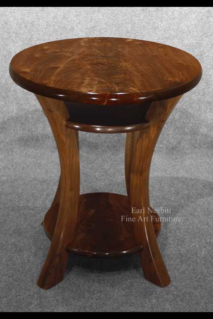 designer end table showing curve of sculpted solid walnut legs